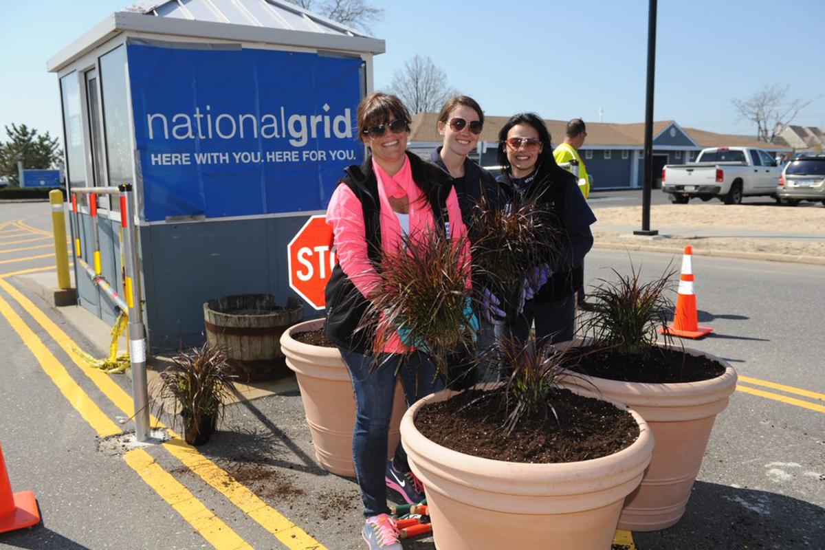 ngemployeesvolunteering.jpg U.S. National Grid colleagues volunteering in the community planting tubs
