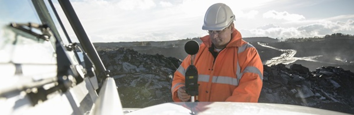 Man taking a noise impact reading