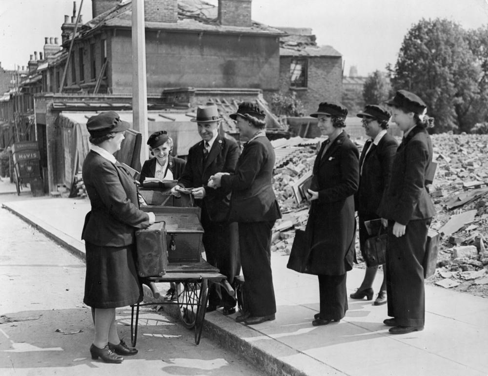 Archive1_WarMeterReaders_1000x770.jpg Picture of war meter readers in front of bombed houses - archive image used in the National Grid story 'Time travelling through the history of energy at the National Grid archive'