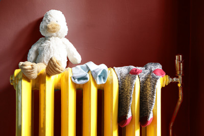 Cuddly duck and socks on radiator