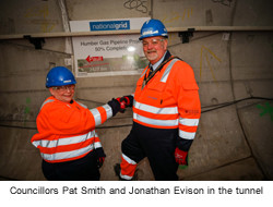 Councillor Pat Smith, Mayor of The East Riding of Yorkshire, shaking hands with Councillor Jonathan Evison, Mayor of North Lincolnshire, in the tunnel - used for the National Grid story 'Celebrating the completion of the Humber Tunnel