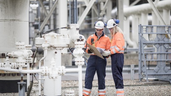 Male and female engineers onsite