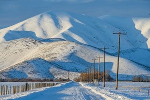 Snow covered road and mountain for National Grid article