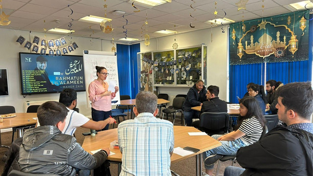 People attending a meeting at the Derby Refugee Advice Centre
