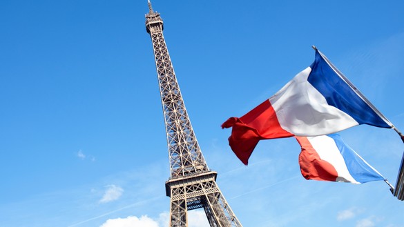 Eiffel Tower with french flag for National Grid Paris Agreement article