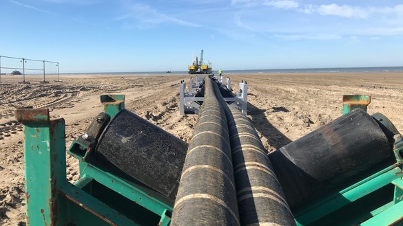 Interconnector cables being pulled across a beach - used for the National Grid article 'Connecting electricity systems for a greener Britain'