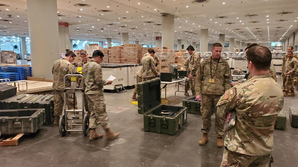 US military personnel in warehouse serving for National Guard - used for 'From National Grid to National Guard' story