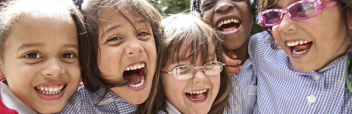 A happy group of female school age children