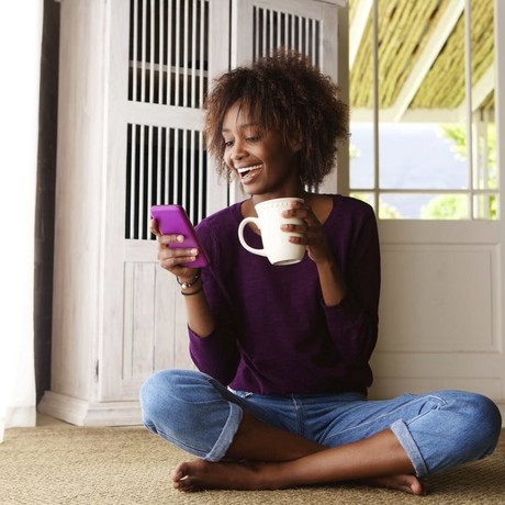 Woman smiling whilst on the phone